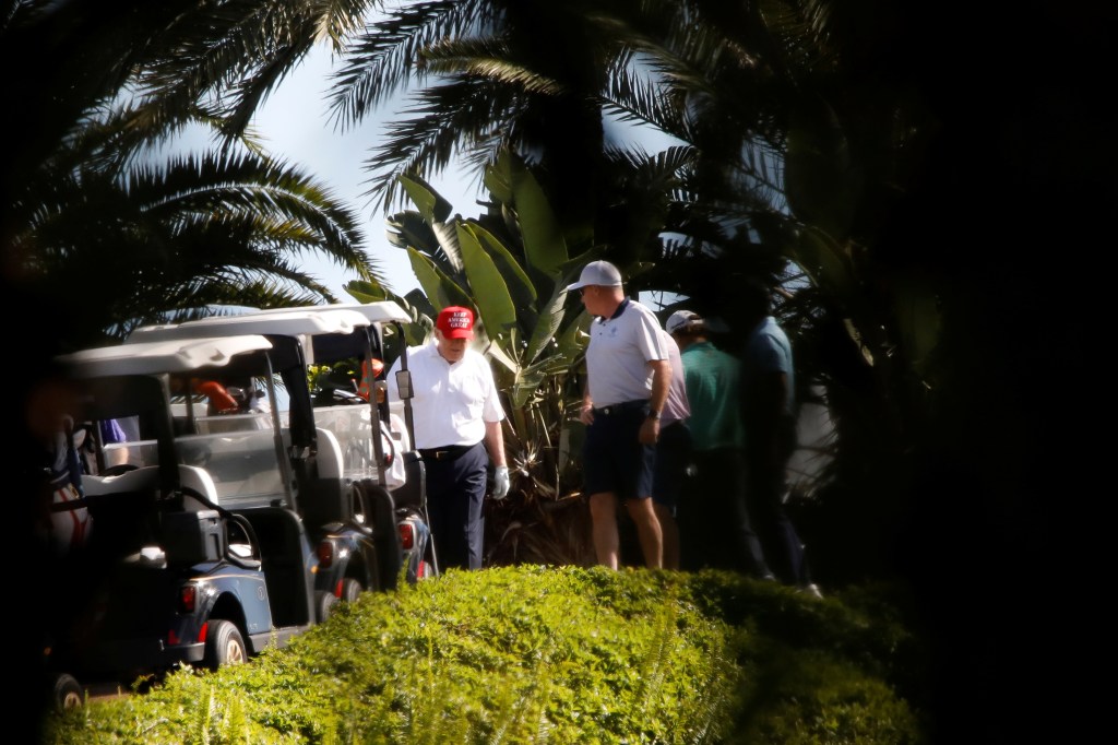 President Donald Trump plays golf at the Trump International Golf Club in West Palm Beach, Florida, U.S., December 27, 2020. 